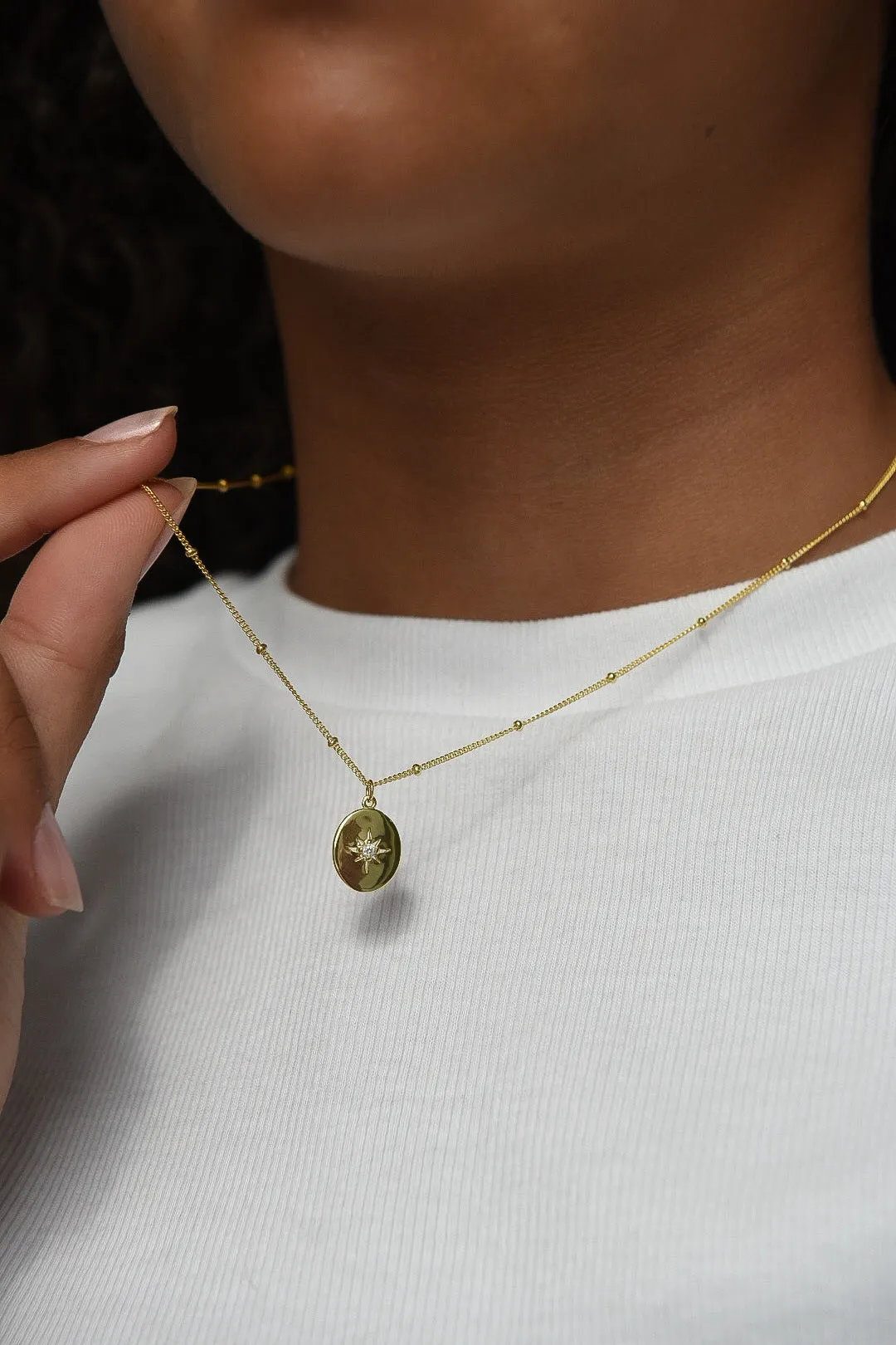 Golden Oval Cz Star Pendant